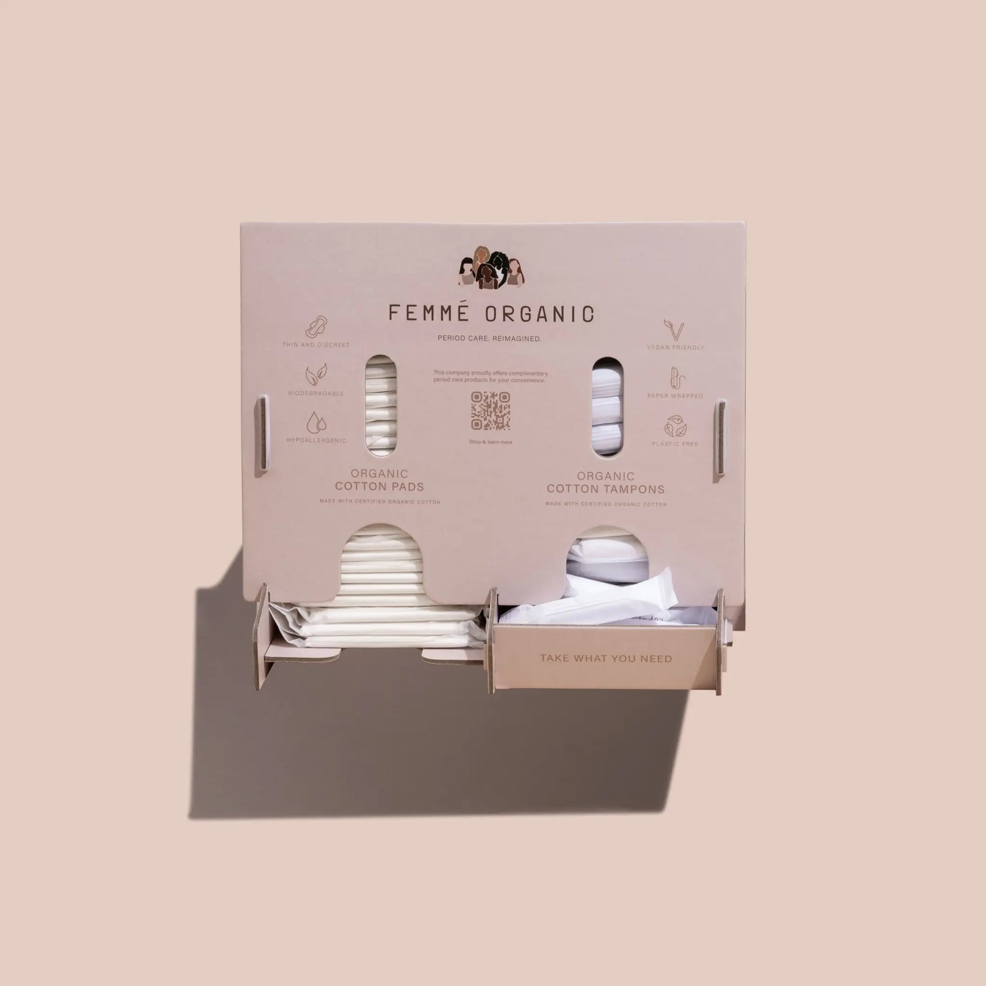 Femme Organic bathroom dispenser with organic period care products, offering plastic-free tampons and pads for sustainable and accessible menstrual hygiene.